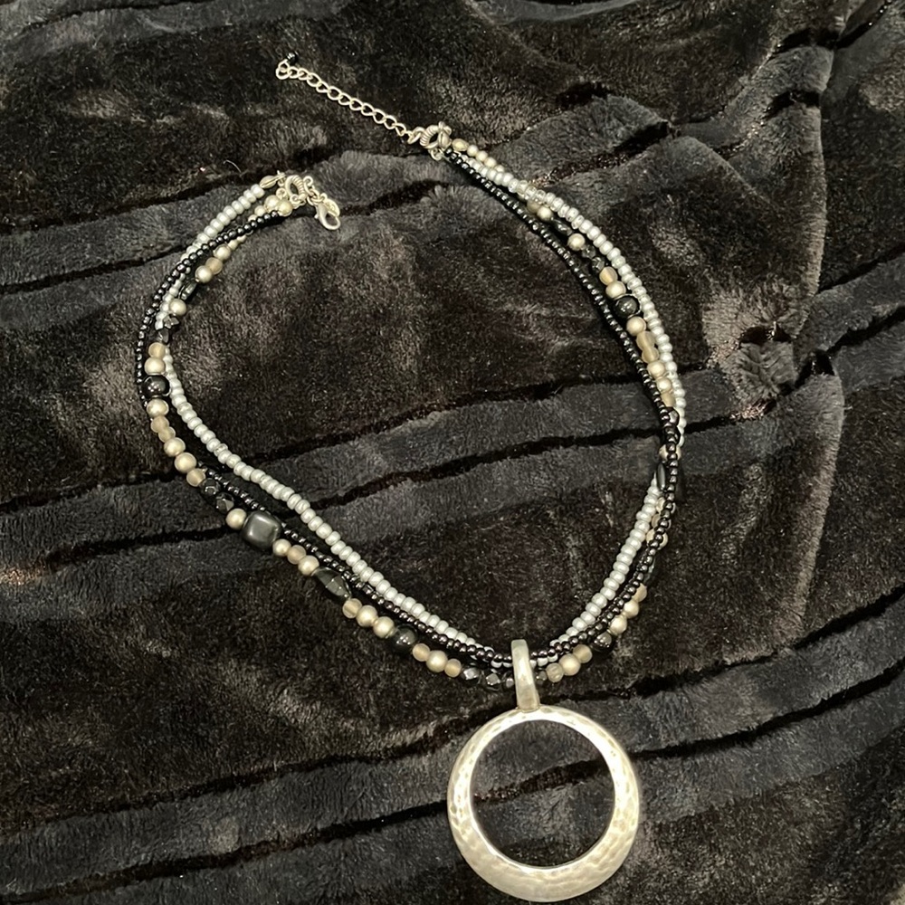 Multi-Strand Black and Silver Beaded Necklace with Hammered Circle Pendant